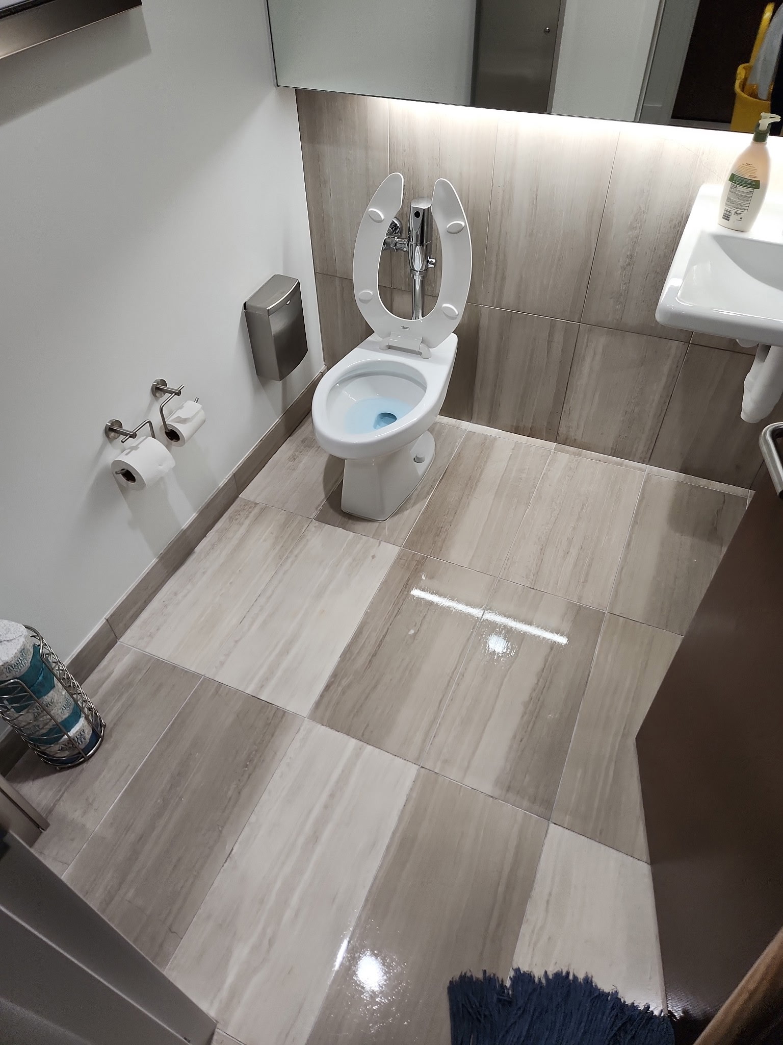 Upscale office bathroom cleaned and sanitized