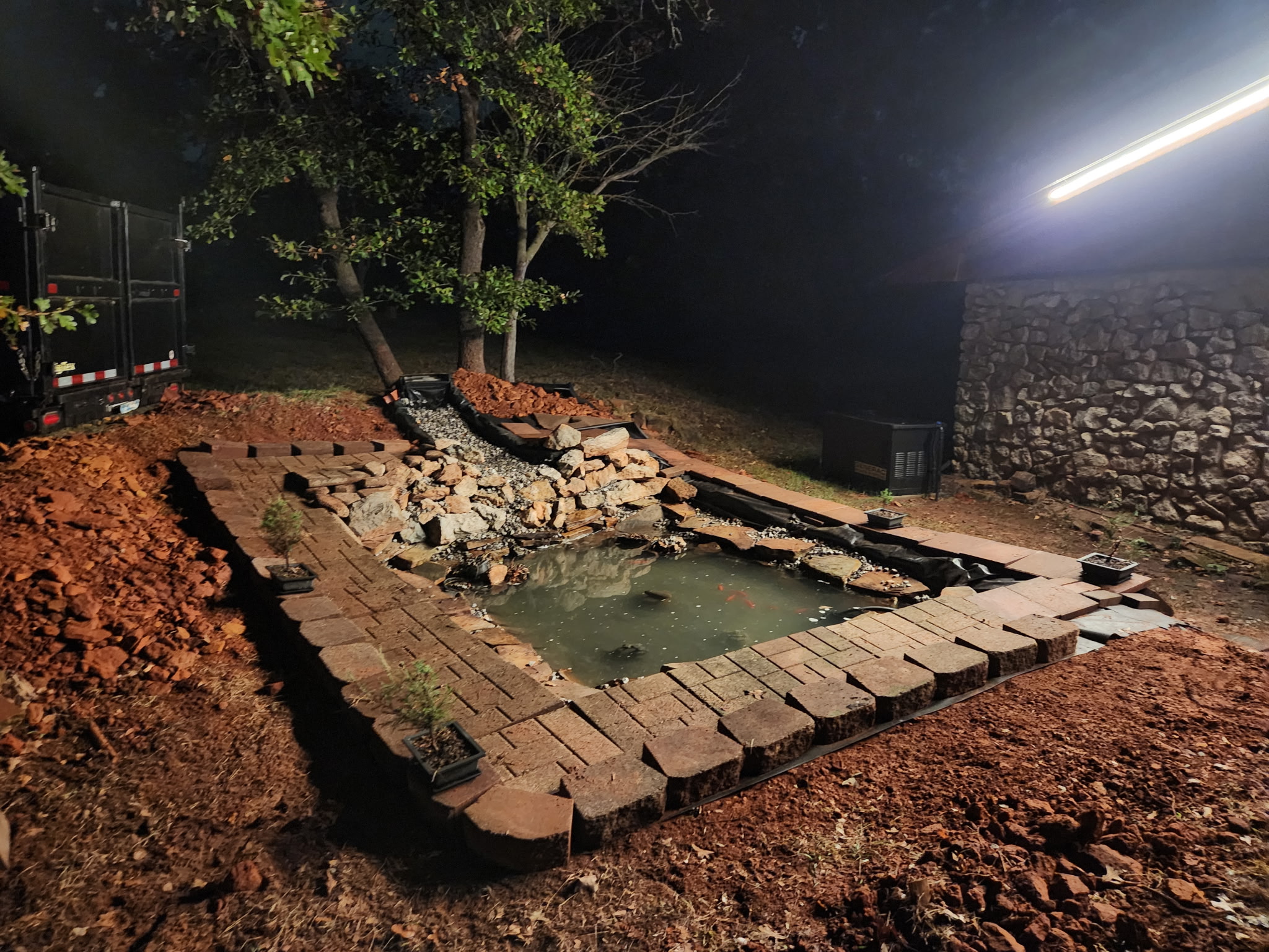 Koi pond and landscape lighting at night
