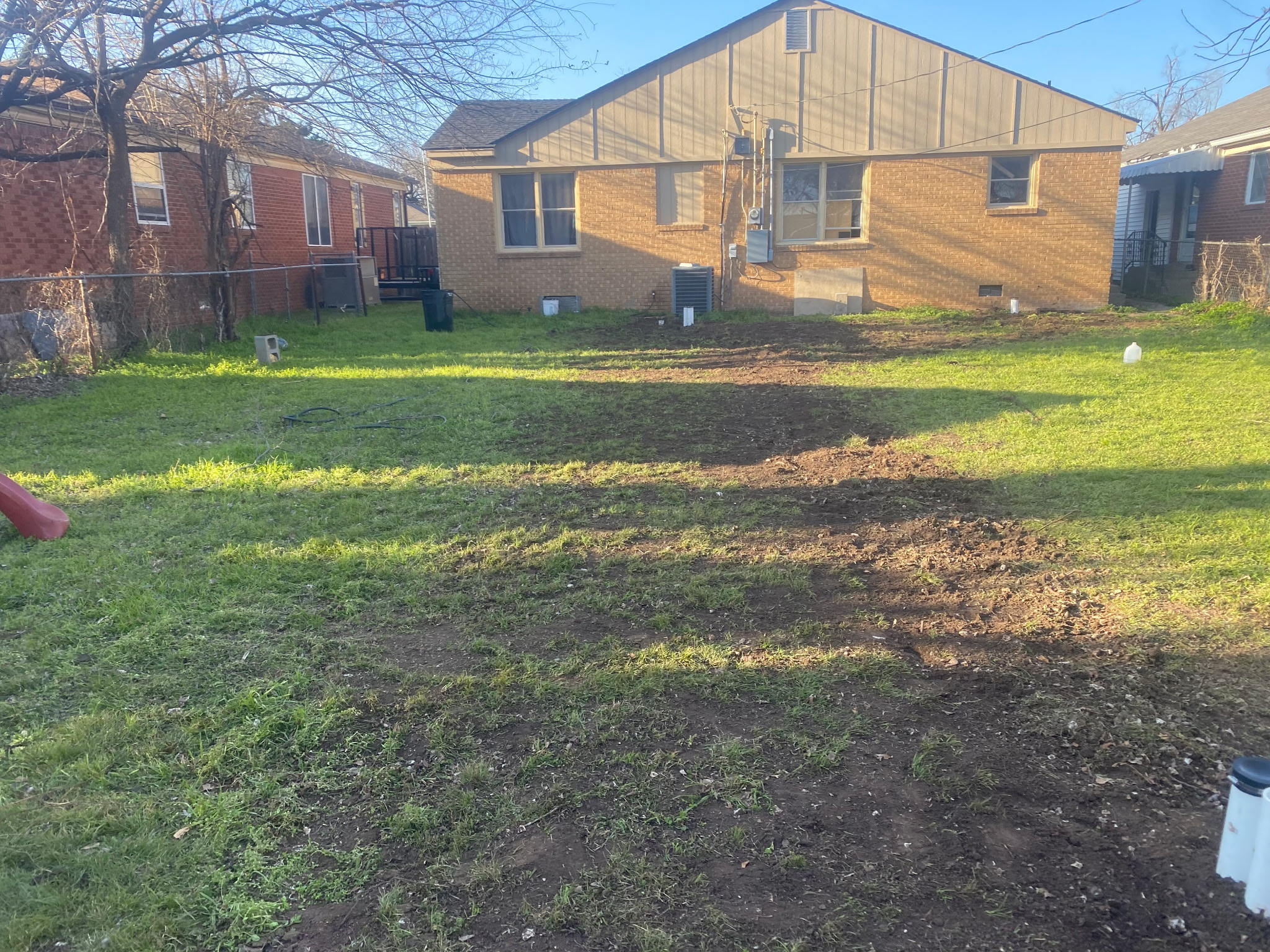 After: new sewer line installed and trench backfilled