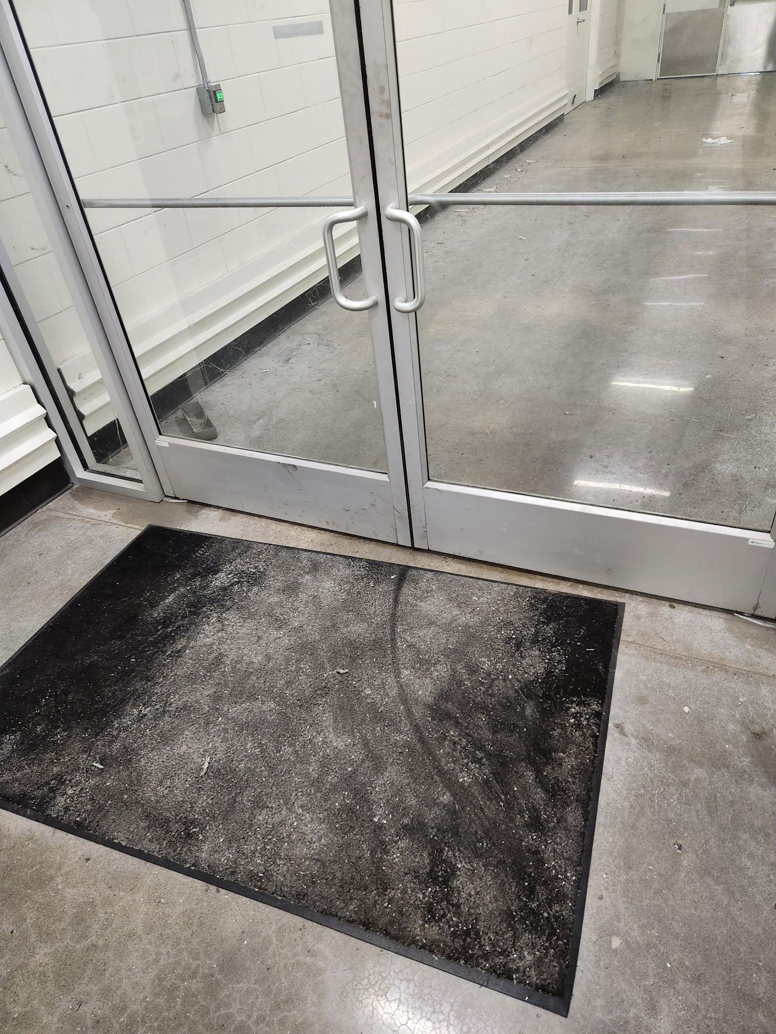 Long hallway with standing water before cleanup