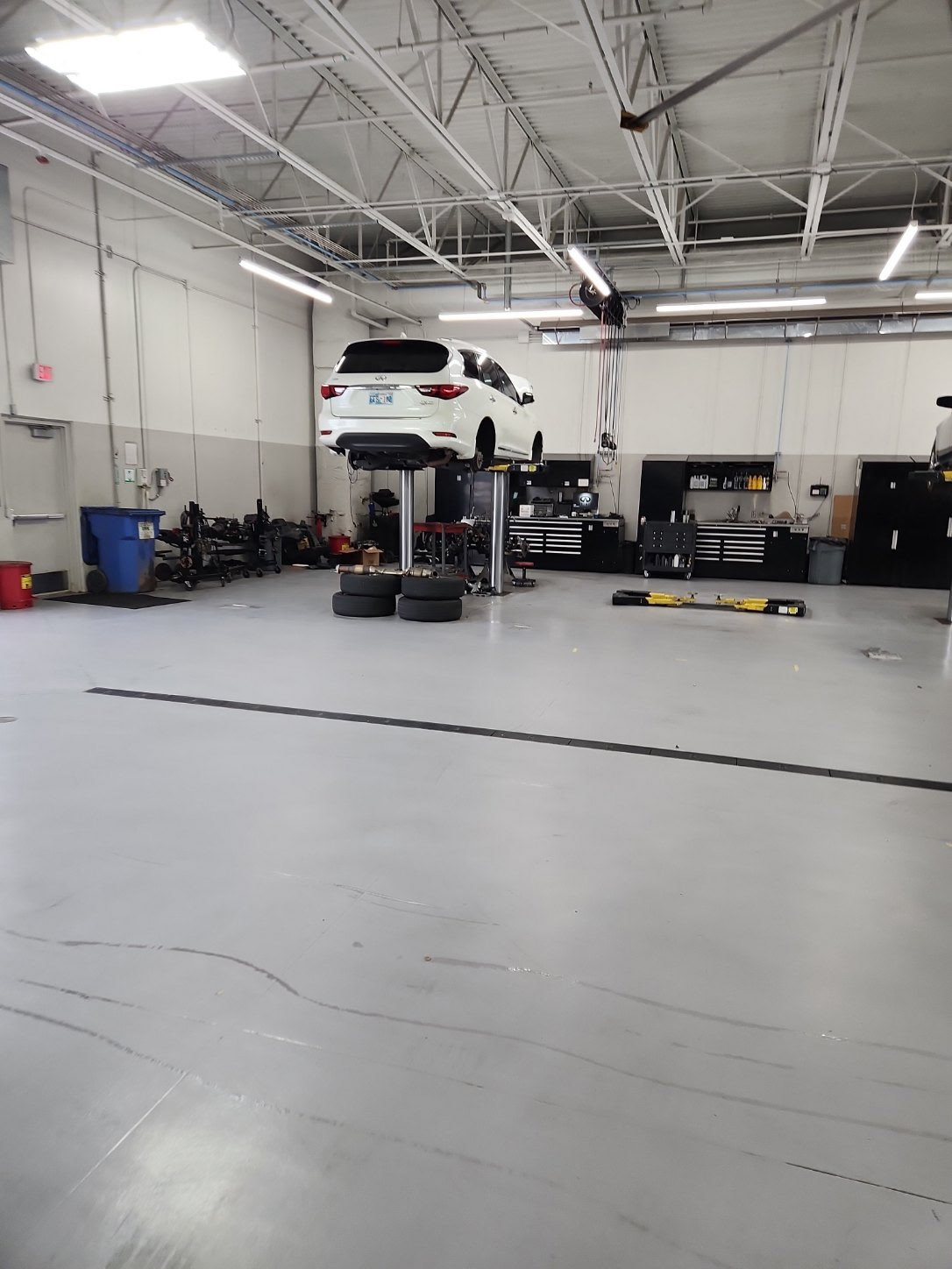 Tech with cleaning equipment in shop