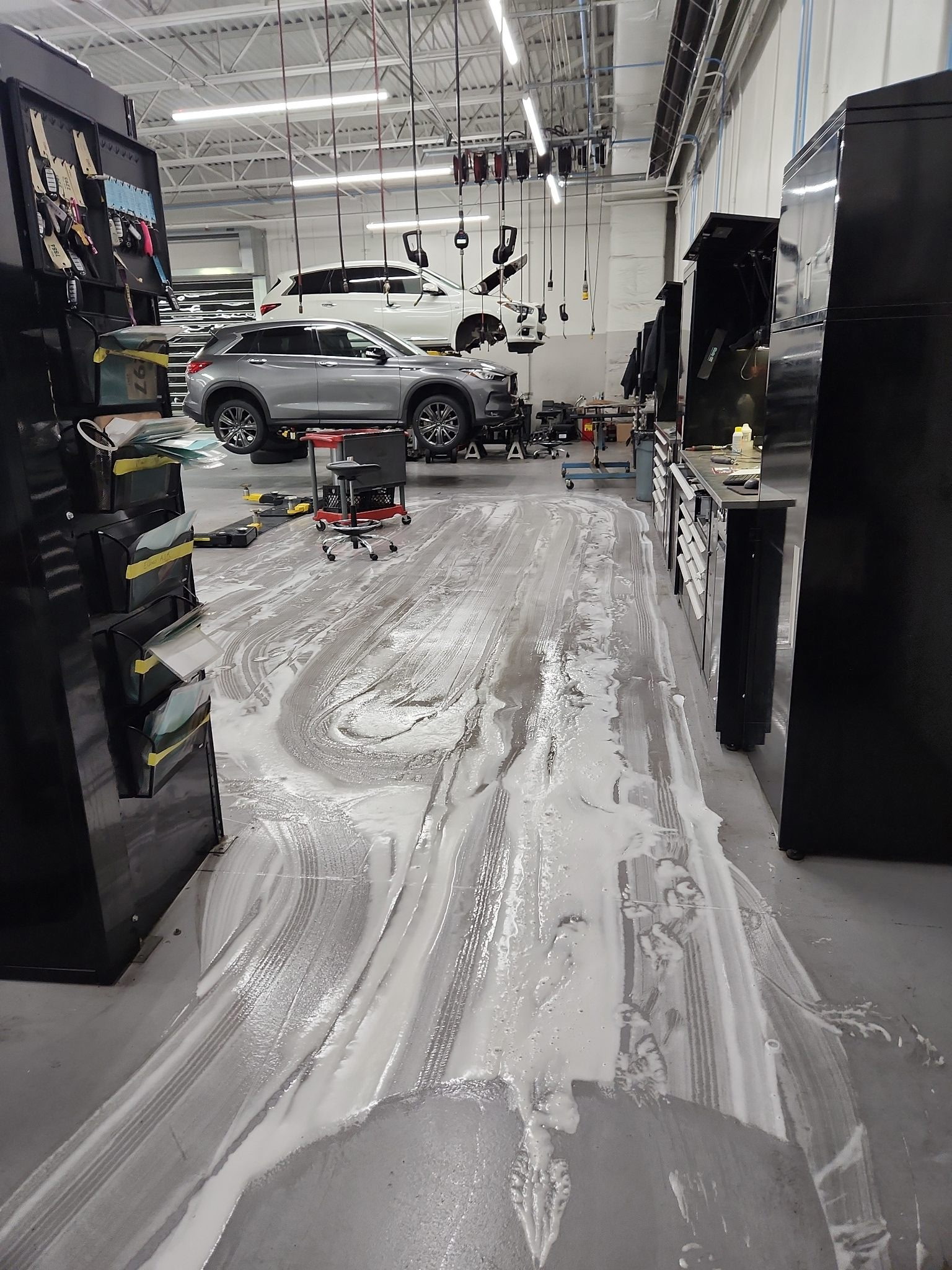 Floor machine scrubbing the shop surface