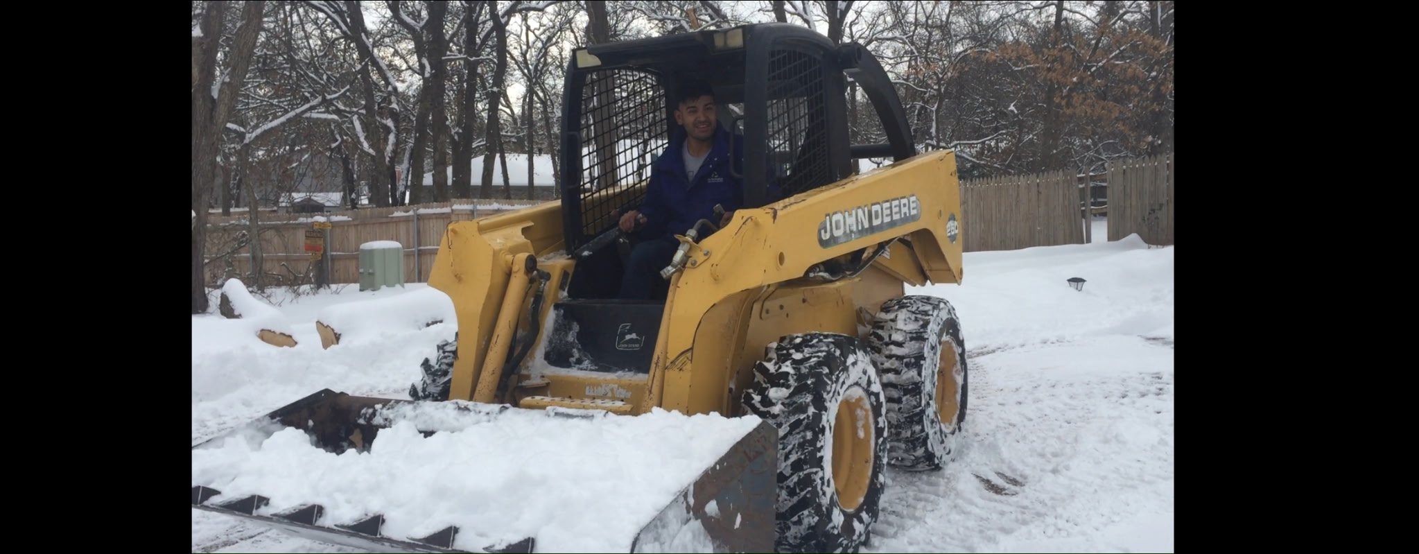 Snow removal with skid loader