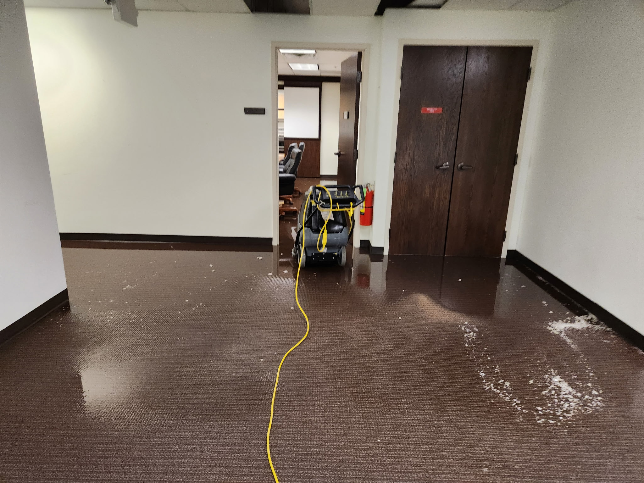 Before: standing water on flooring before extraction